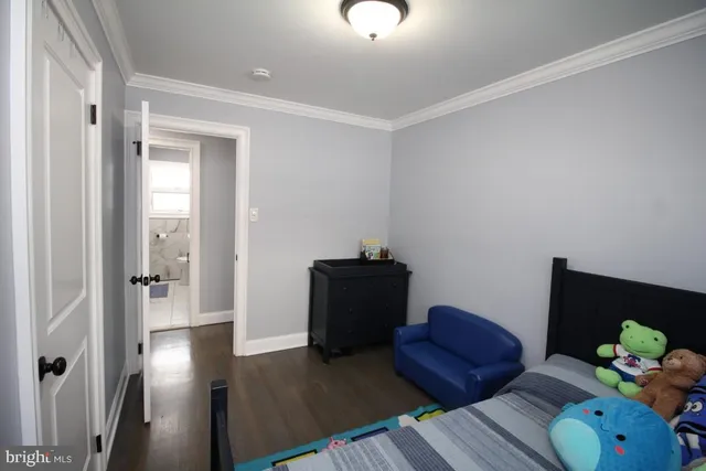 a spacious bathroom with a shower sink and mirror