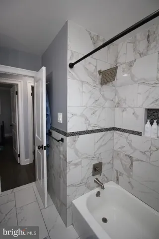 a bedroom with bed and window