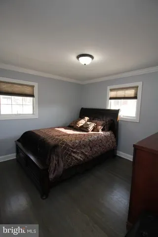 a bedroom with bed and window