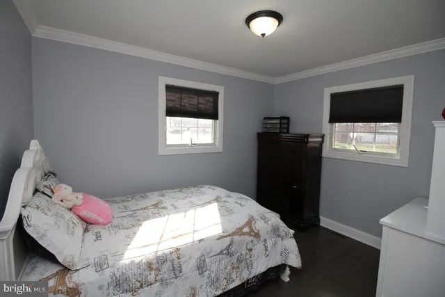 a bedroom with a bed and hallway