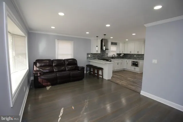 a kitchen with a table and chairs