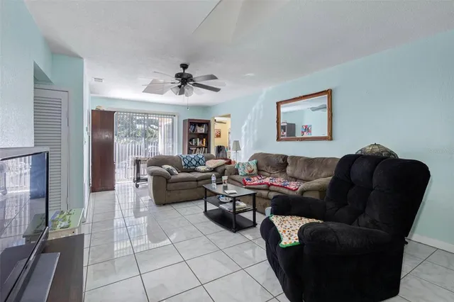 a living room with furniture and a window