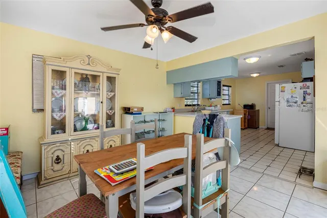 a living room with furniture a flat screen tv and a table