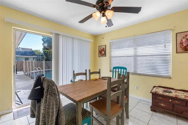 a view of a dining room with furniture and window