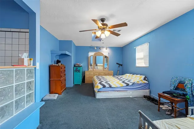 a bedroom with bed and window