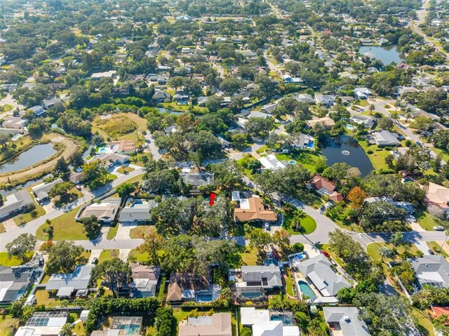 an aerial view of residential houses with outdoor space