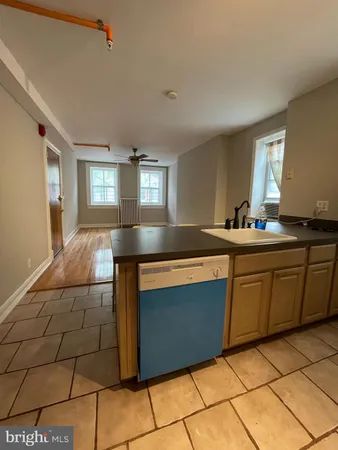 a kitchen with stainless steel appliances a sink and a counter top space