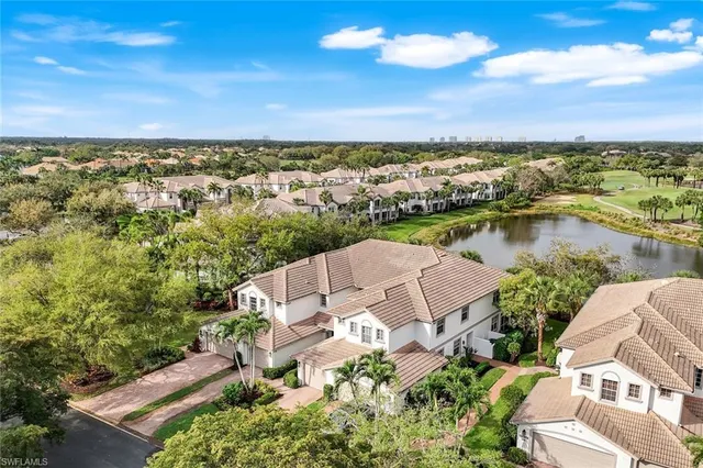 an aerial view of a house with a lake view