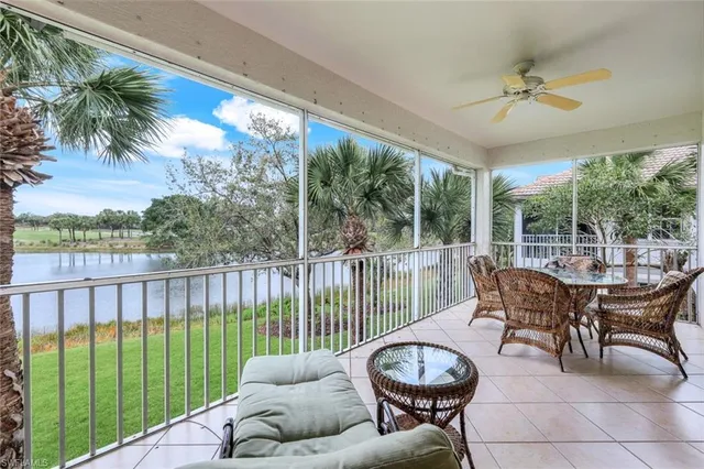 a balcony with furniture and a potted plant