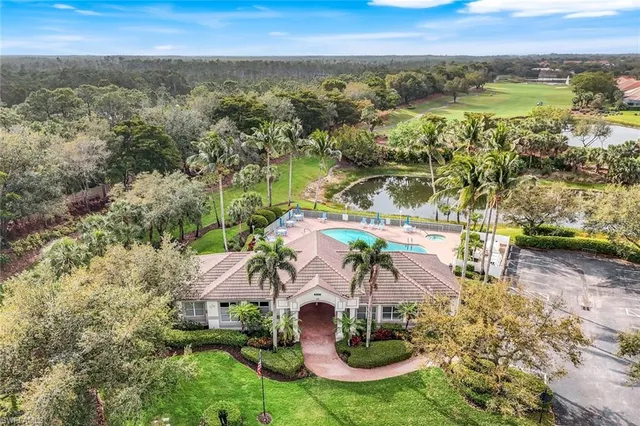 an aerial view of residential house with outdoor space and swimming pool