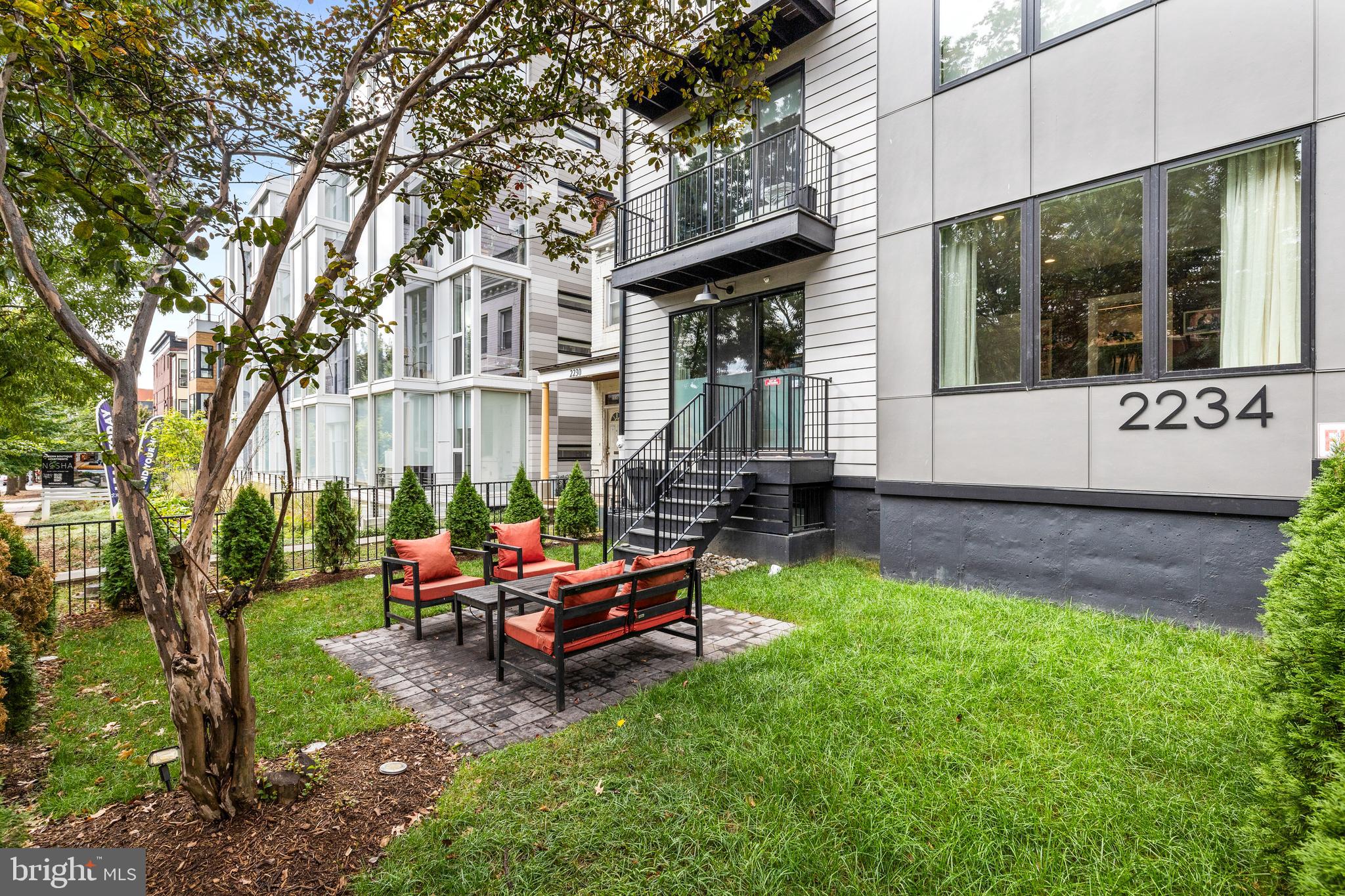 2234 11th Street Northwest, Unit 101 Washington, DC 20001 - Photo 21 of 25 a backyard of a house with seating space