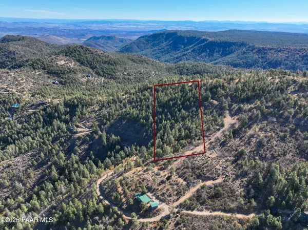 a view of a city with mountains in the background