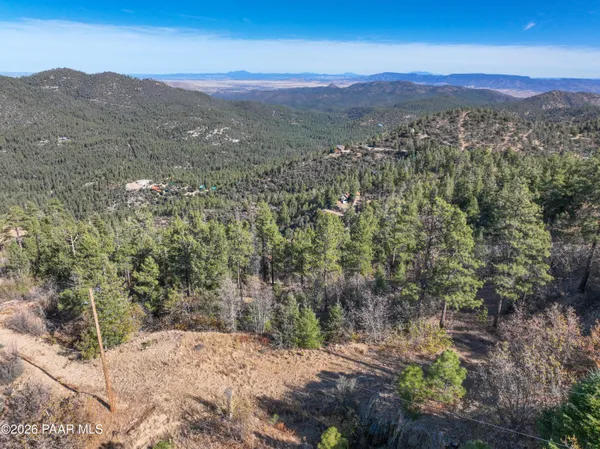 a view of a mountain with mountains in the background
