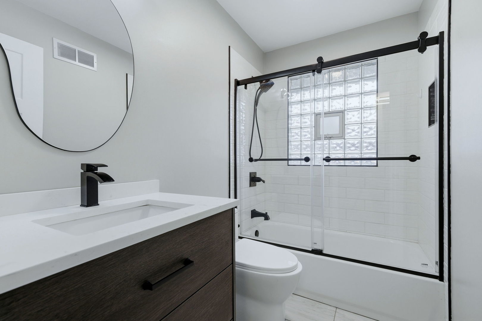 28-w032 Roosevelt Road Winfield, IL 60190 - Photo 11 of 35 a bathroom with a sink toilet and shower