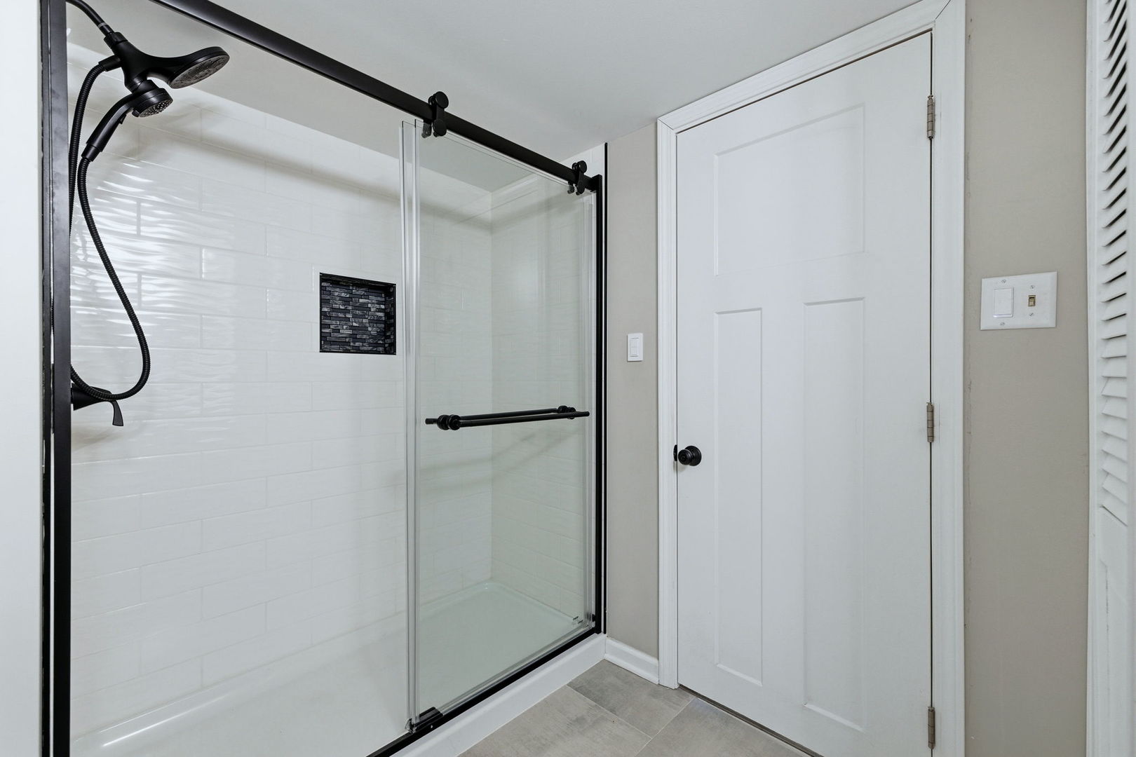 28-w032 Roosevelt Road Winfield, IL 60190 - Photo 17 of 35 a bathroom with a glass shower door