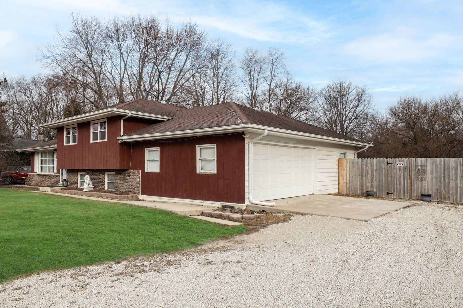 28-w032 Roosevelt Road Winfield, IL 60190 - Photo 2 of 35 a front view of a house with a yard and garage