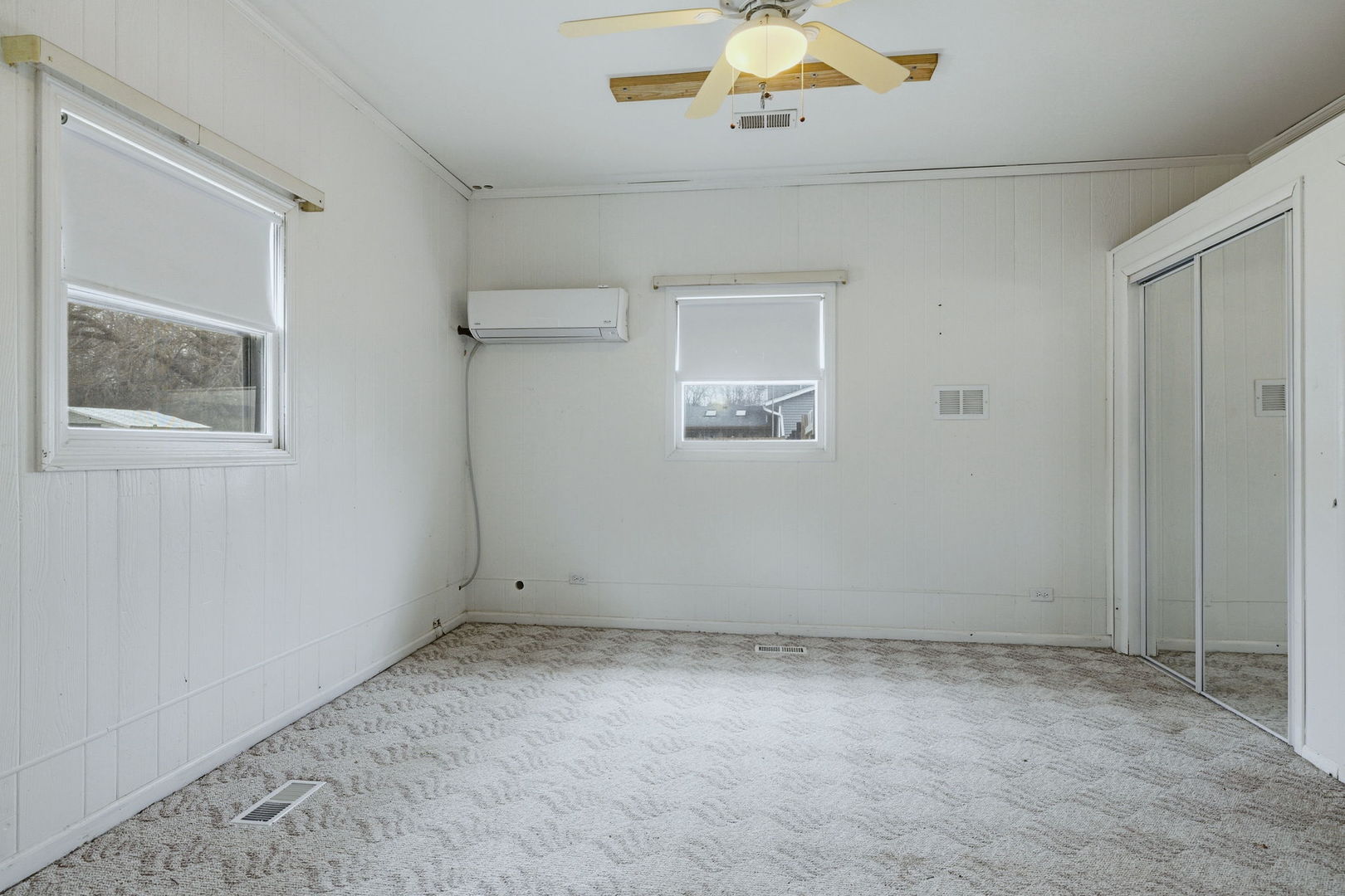 28-w032 Roosevelt Road Winfield, IL 60190 - Photo 21 of 35 an empty room with a chandelier fan