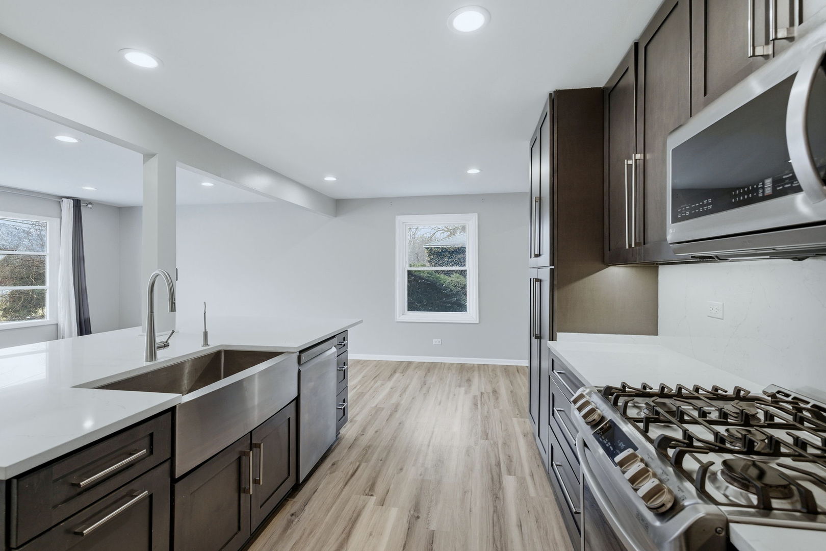 28-w032 Roosevelt Road Winfield, IL 60190 - Photo 8 of 35 a kitchen with stainless steel appliances a sink stove and cabinets