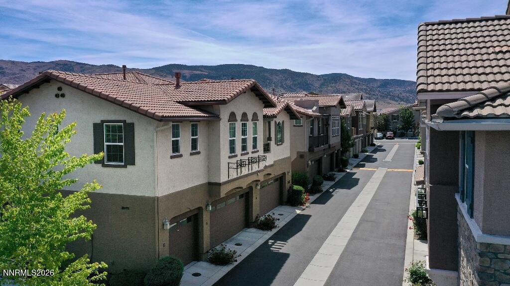 1864 Wind Ranch Road, Unit B Reno, NV 89521 - Photo 3 of 42 a view of a house with a outdoor space
