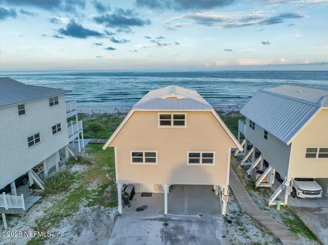 an aerial view of a house with outdoor space