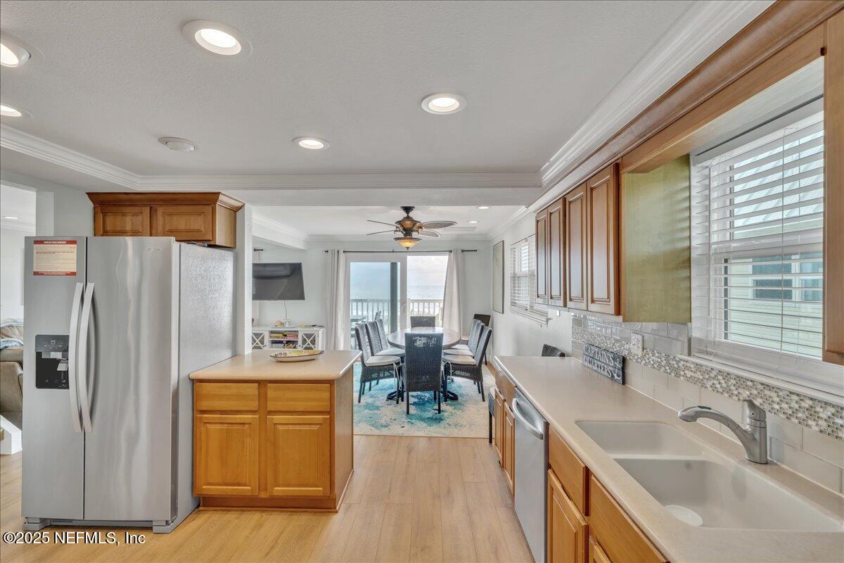 4491 Surfside Lane Port St. Joe, FL 32456 - Photo 11 of 84 a kitchen with stainless steel appliances granite countertop a sink stove and refrigerator