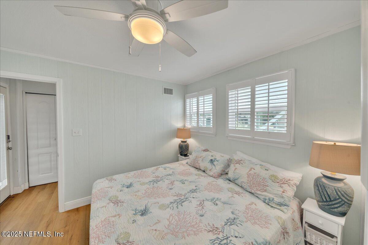 4491 Surfside Lane Port St. Joe, FL 32456 - Photo 13 of 84 a bedroom with a bed and a window