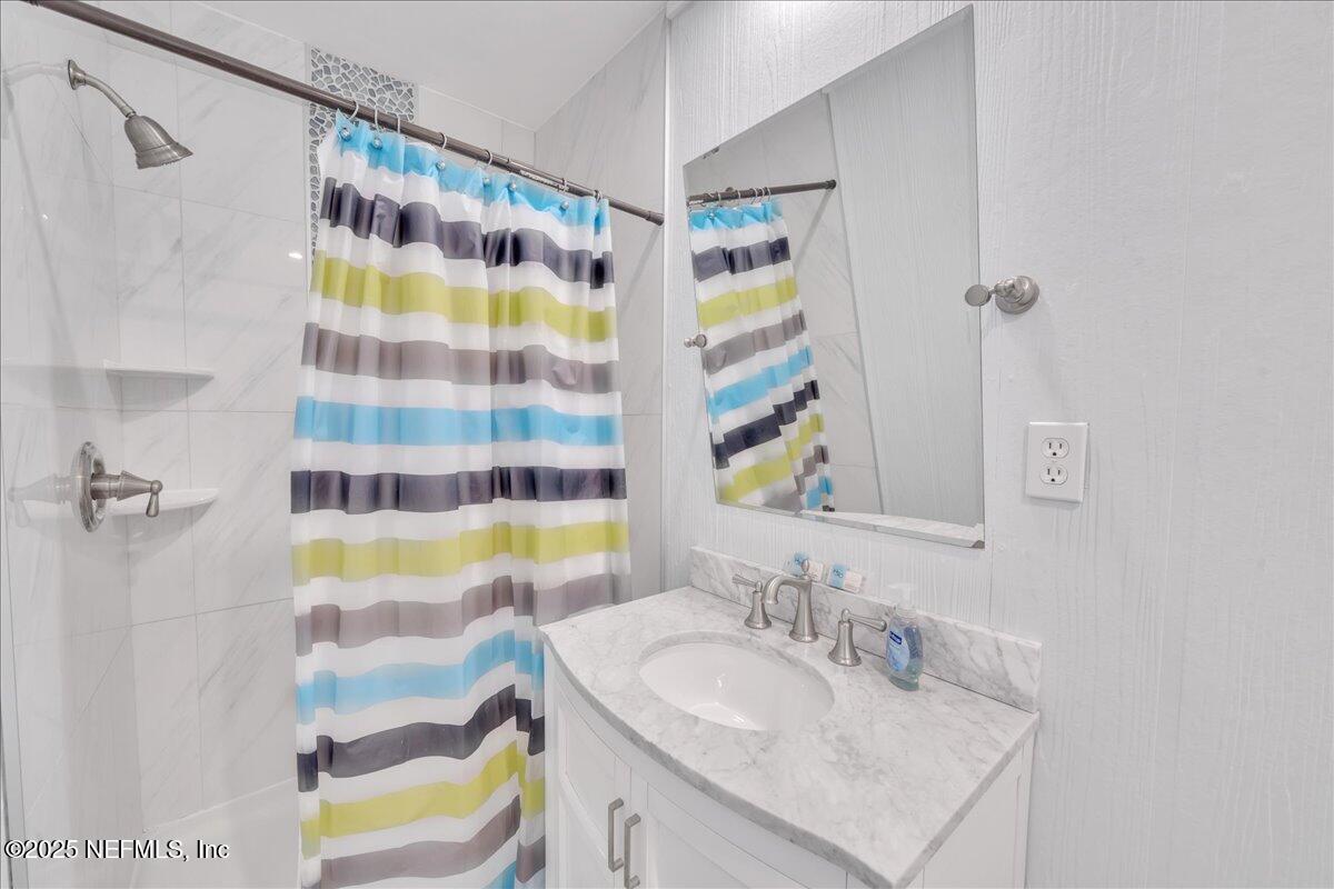 4491 Surfside Lane Port St. Joe, FL 32456 - Photo 14 of 84 a bathroom with a sink and a bathtub