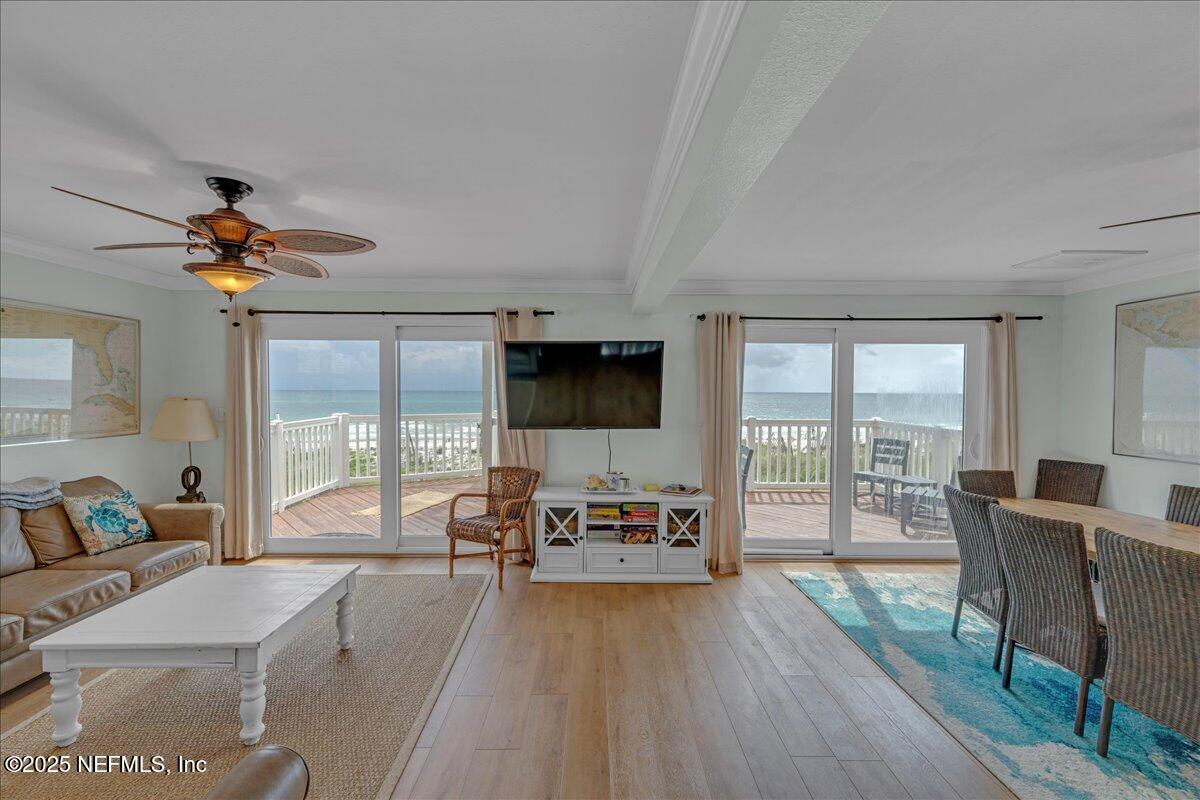 4491 Surfside Lane Port St. Joe, FL 32456 - Photo 17 of 84 a living room with furniture and a flat screen tv