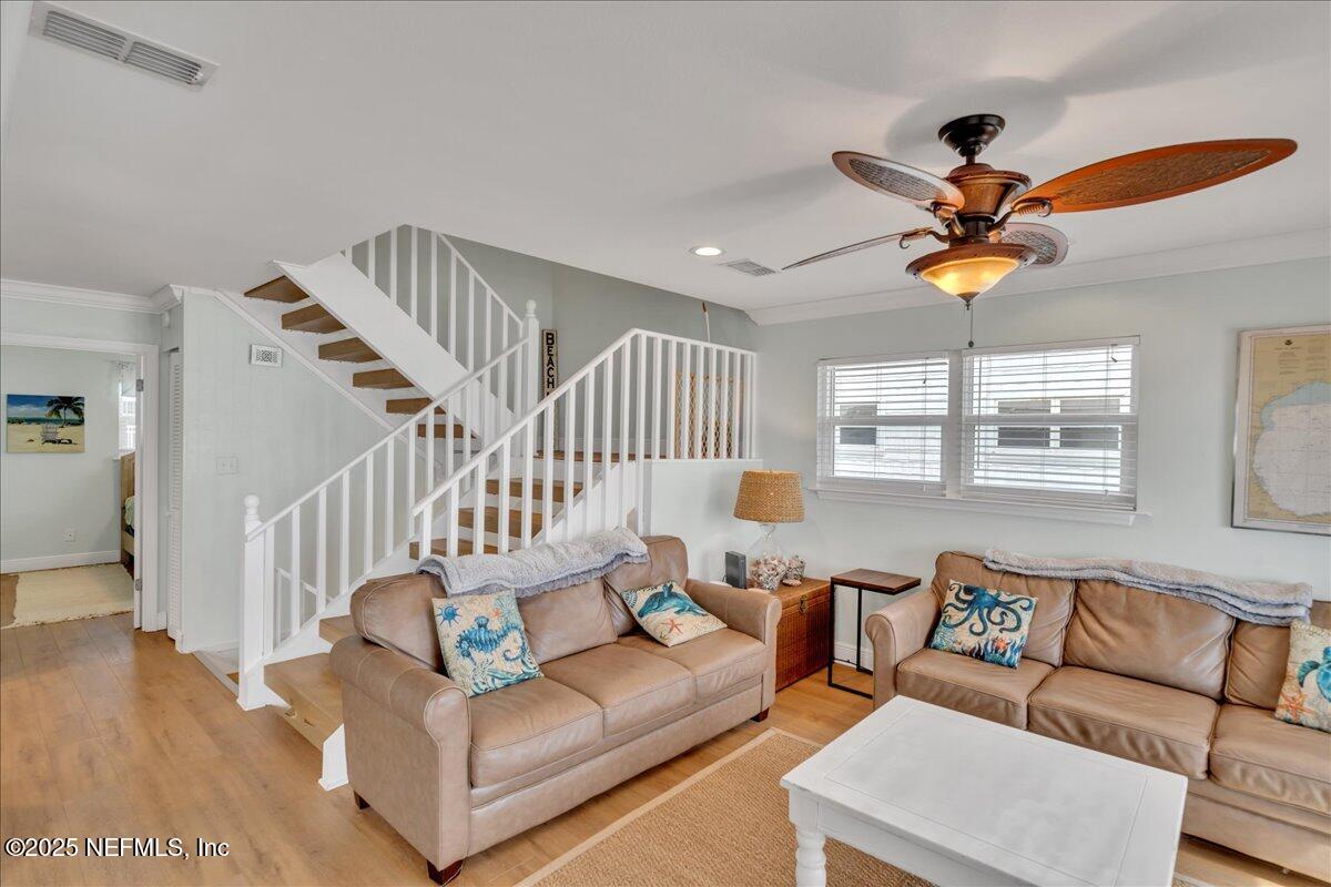 4491 Surfside Lane Port St. Joe, FL 32456 - Photo 18 of 84 a living room with furniture ceiling fan and a rug