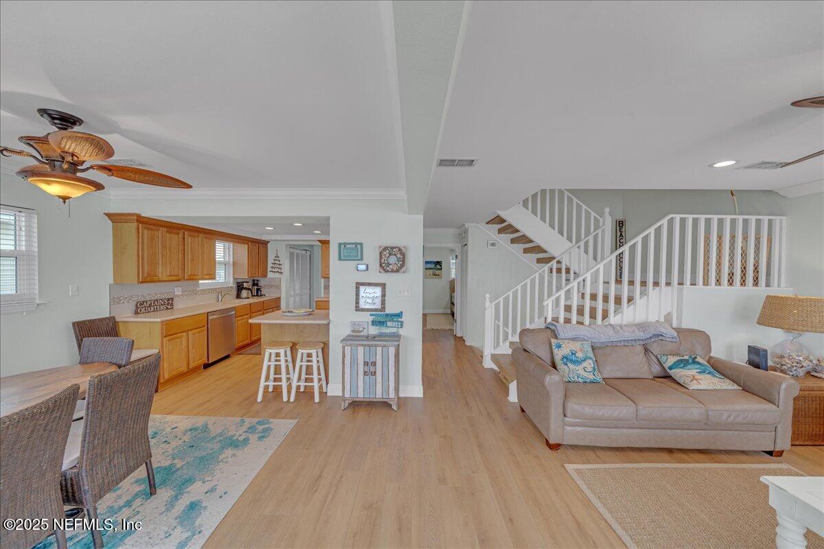 4491 Surfside Lane Port St. Joe, FL 32456 - Photo 20 of 84 a living room with furniture and a wooden floor