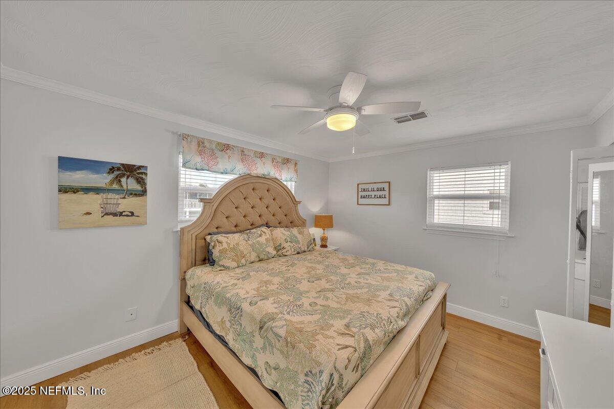 4491 Surfside Lane Port St. Joe, FL 32456 - Photo 21 of 84 a bedroom with a bed and a window