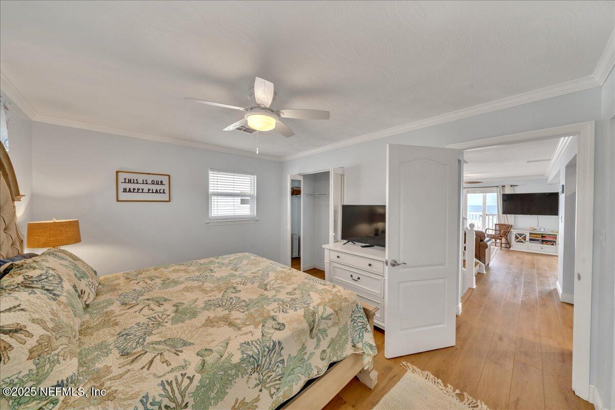 4491 Surfside Lane Port St. Joe, FL 32456 - Photo 23 of 84 a bedroom with a bed and a flat screen tv
