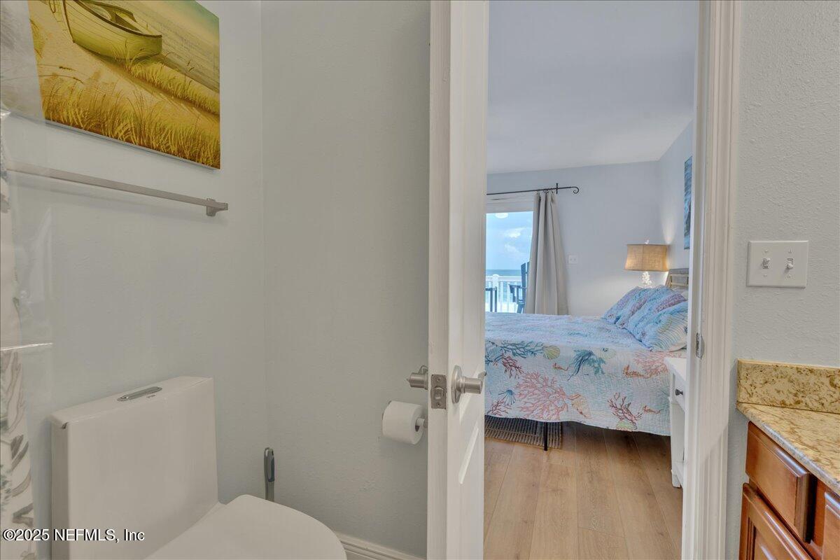 4491 Surfside Lane Port St. Joe, FL 32456 - Photo 32 of 84 a bathroom with a toilet sink and mirror