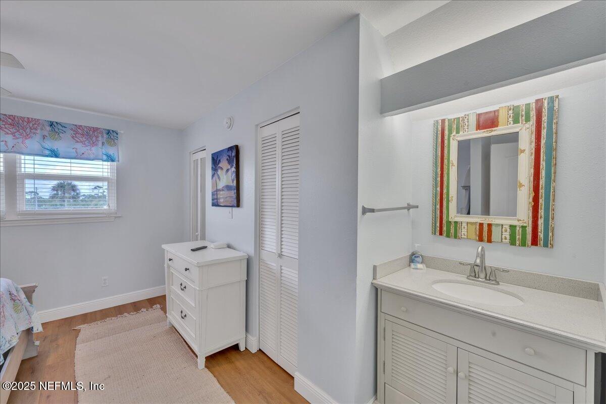 4491 Surfside Lane Port St. Joe, FL 32456 - Photo 34 of 84 a en suite bathroom with a double vanity sink and a mirror