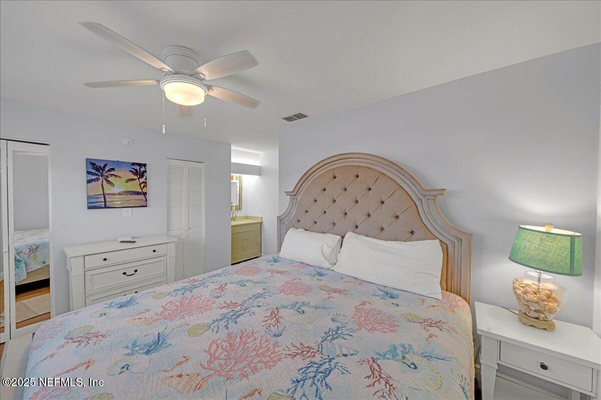 4491 Surfside Lane Port St. Joe, FL 32456 - Photo 38 of 84 a bedroom with a bed and a dresser