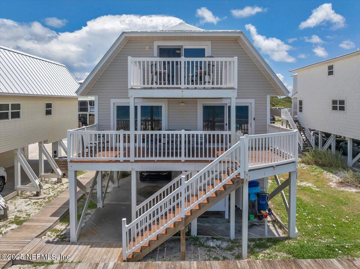 4491 Surfside Lane Port St. Joe, FL 32456 - Photo 48 of 84 a view of a house with a deck and furniture
