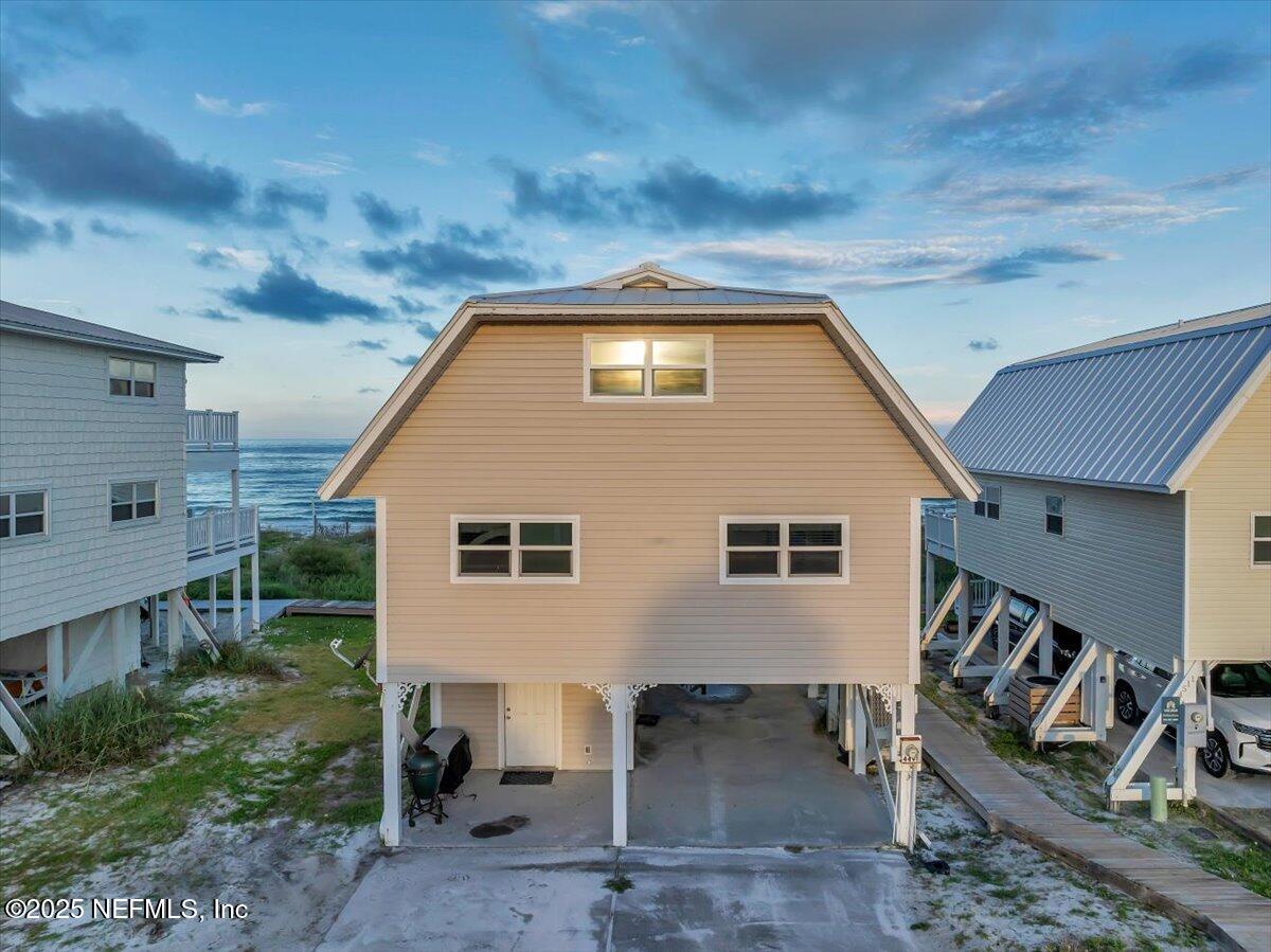 4491 Surfside Lane Port St. Joe, FL 32456 - Photo 51 of 84 a backyard of a house with seating space
