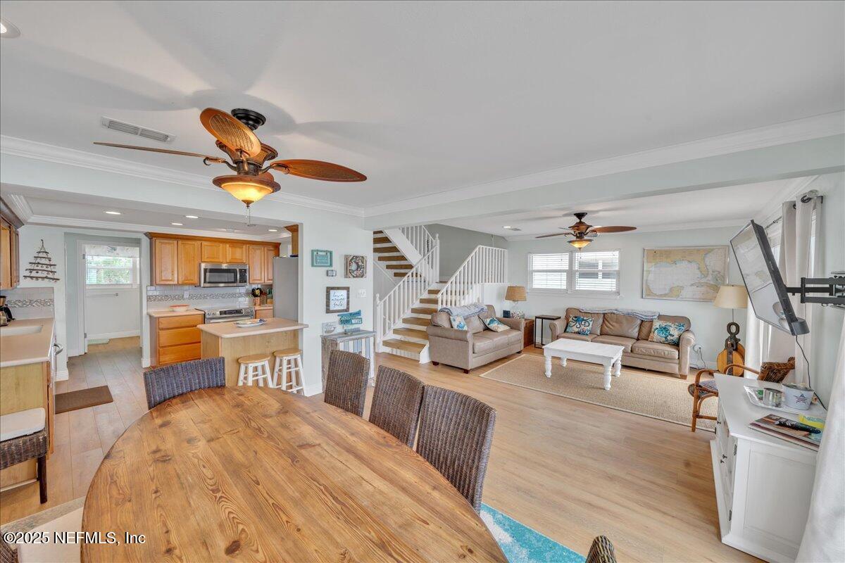 4491 Surfside Lane Port St. Joe, FL 32456 - Photo 6 of 84 a living room with furniture a rug kitchen view and a large window