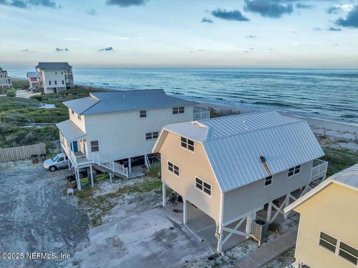 4491 Surfside Lane Port St. Joe, FL 32456 - Photo 79 of 84 an aerial view of a house with roof deck front of house