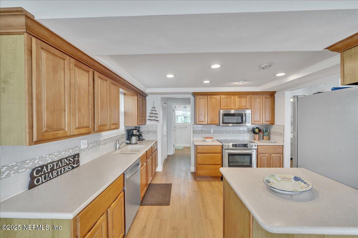 4491 Surfside Lane Port St. Joe, FL 32456 - Photo 10 of 84 a kitchen with stainless steel appliances granite countertop a sink stove and refrigerator