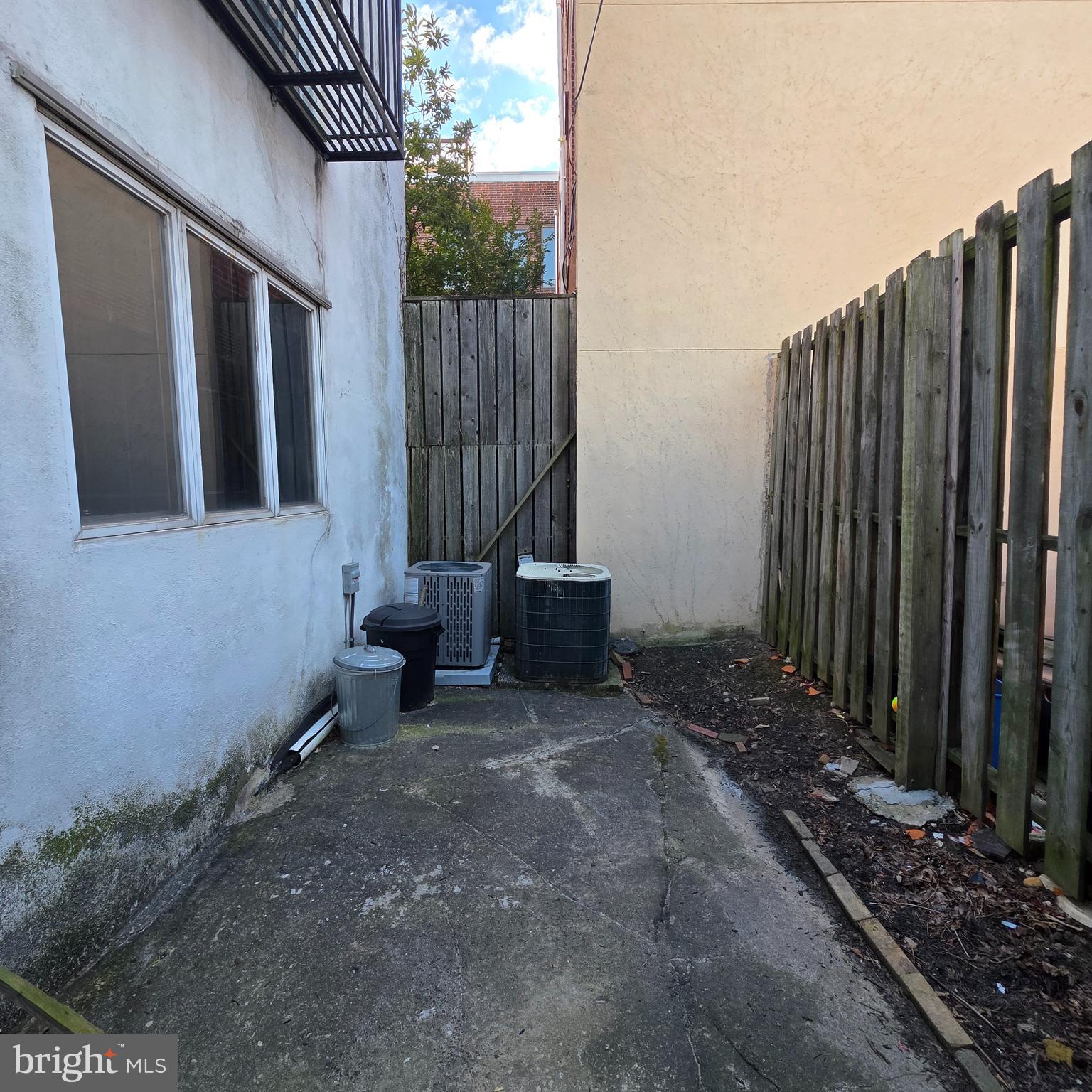 740 East Passyunk Avenue, Unit A Philadelphia, PA 19147 - Photo 11 of 20 a view of a backyard with wooden fence and a bench