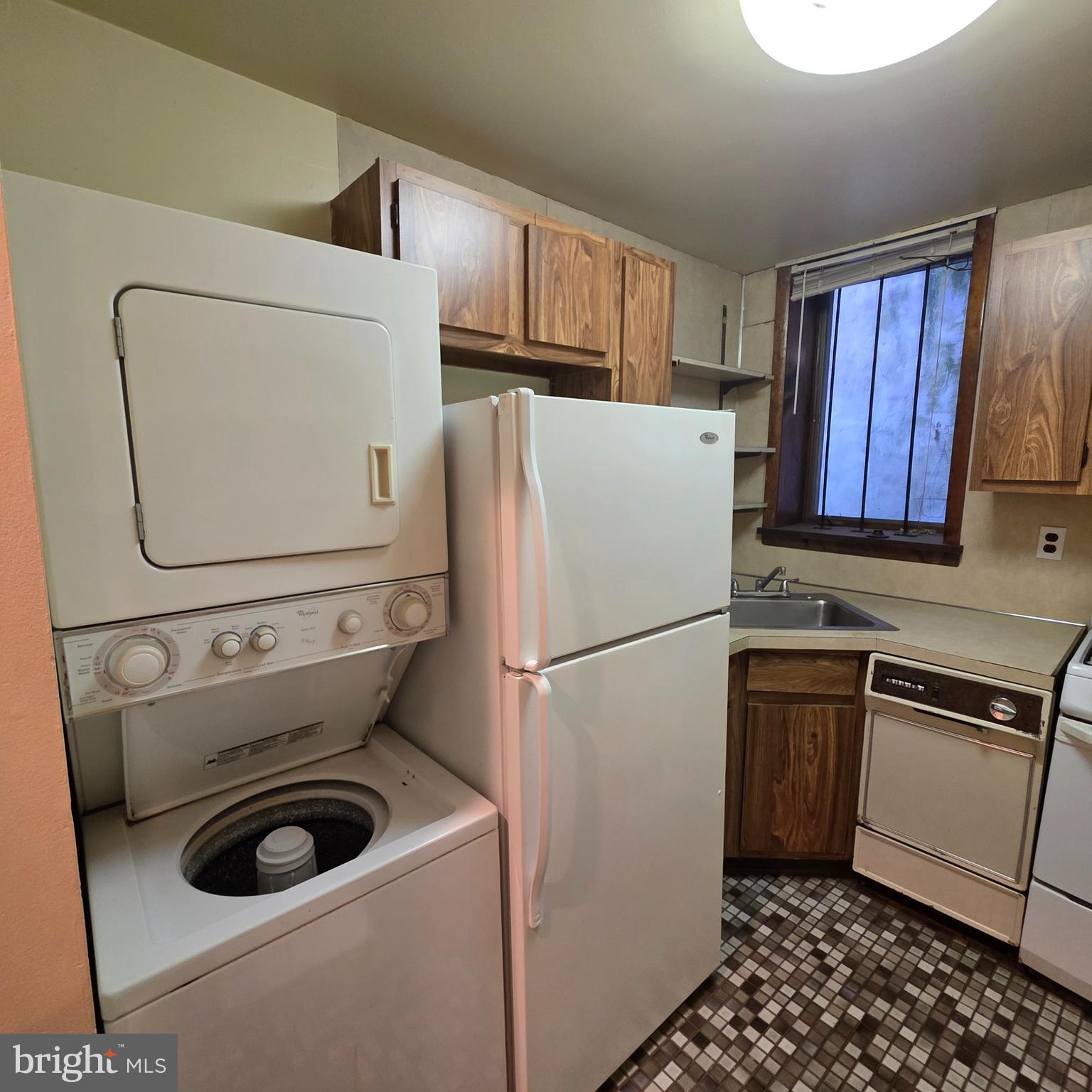 740 East Passyunk Avenue, Unit A Philadelphia, PA 19147 - Photo 14 of 20 a white refrigerator freezer and a stove sitting inside of a kitchen