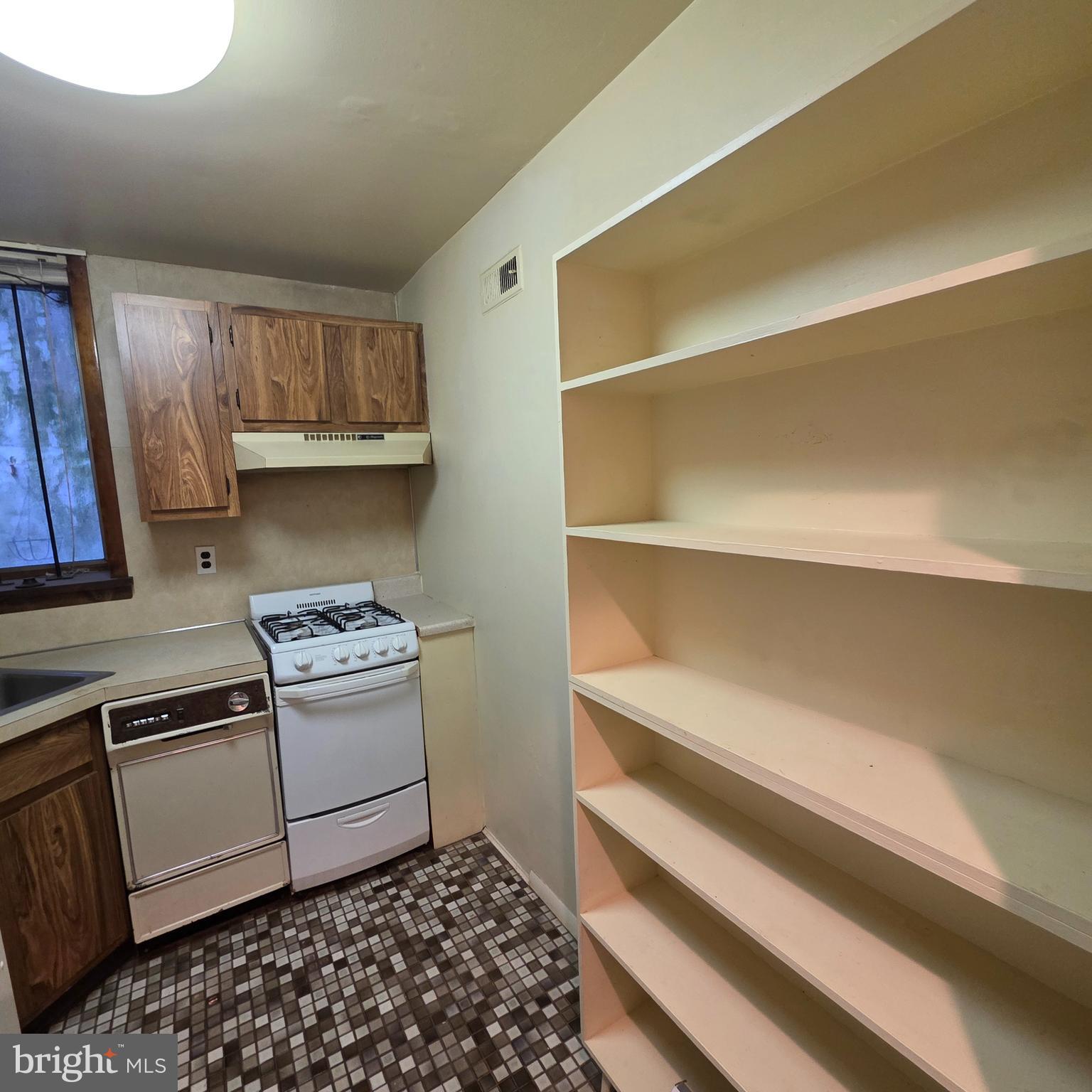 740 East Passyunk Avenue, Unit A Philadelphia, PA 19147 - Photo 15 of 20 a kitchen with a sink a stove and cabinets