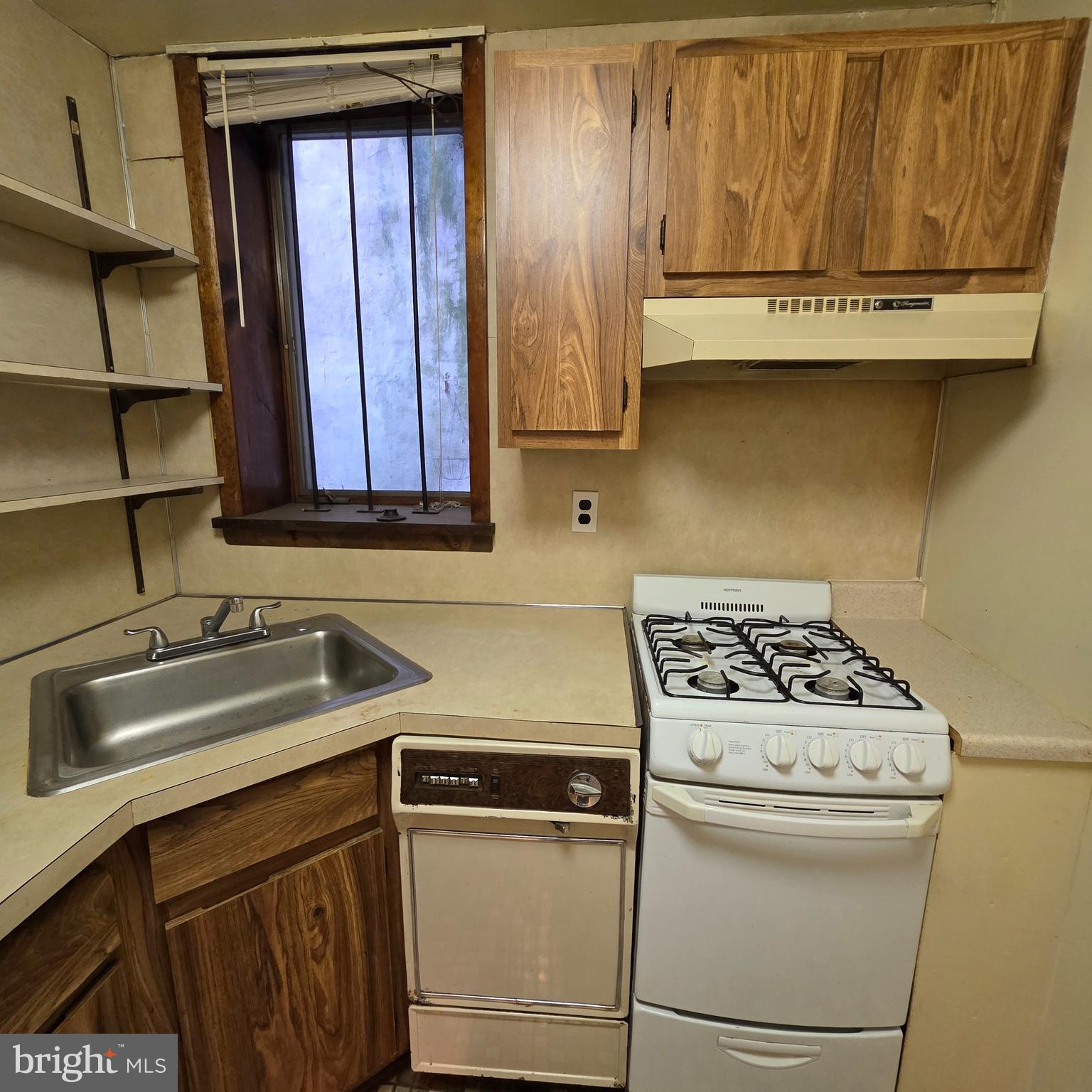 740 East Passyunk Avenue, Unit A Philadelphia, PA 19147 - Photo 16 of 20 a kitchen with stainless steel appliances granite countertop a sink stove and cabinets