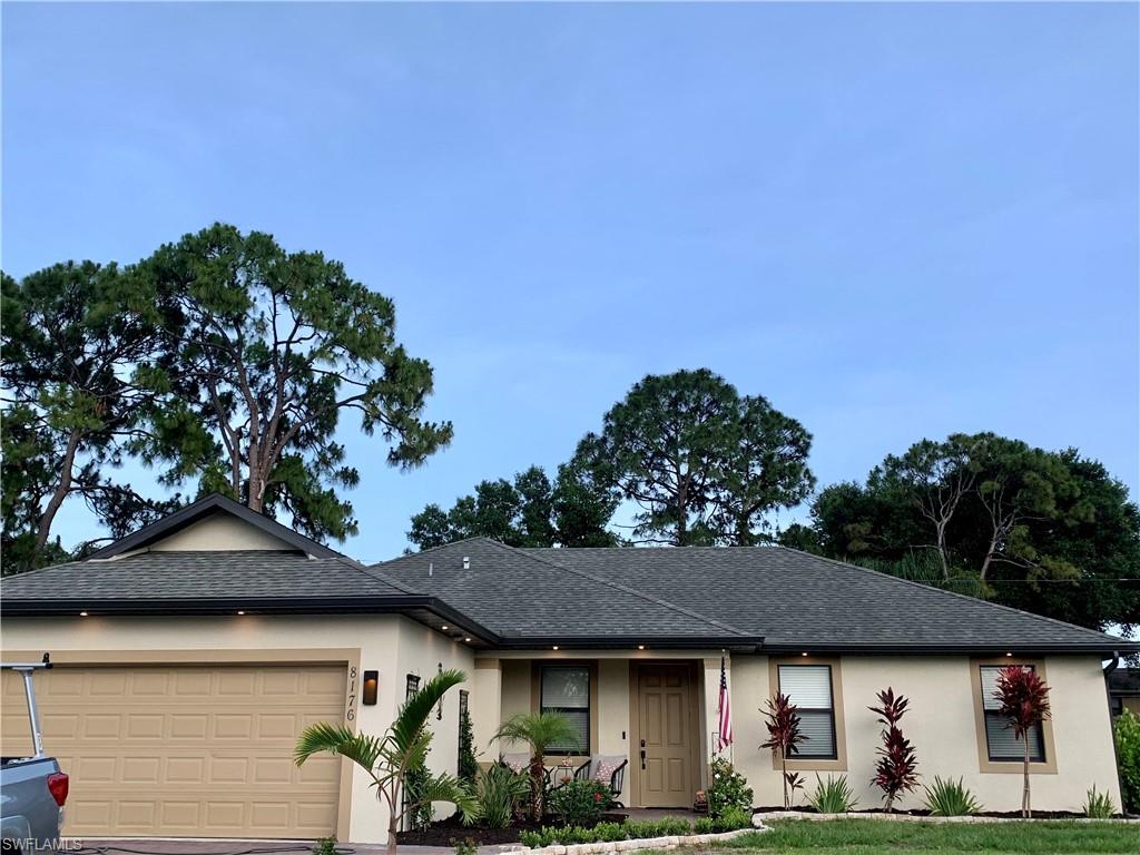 8176 Anhinga Road Fort Myers, FL 33967 - Photo 1 of 1 a front view of a house with garden