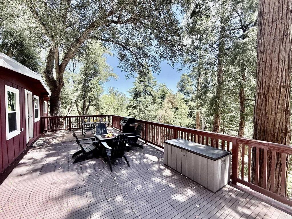 22292 Crestline Road Palomar Mountain, CA 92060 - Photo 15 of 38 a view of a wooden chairs and bench on the roof deck