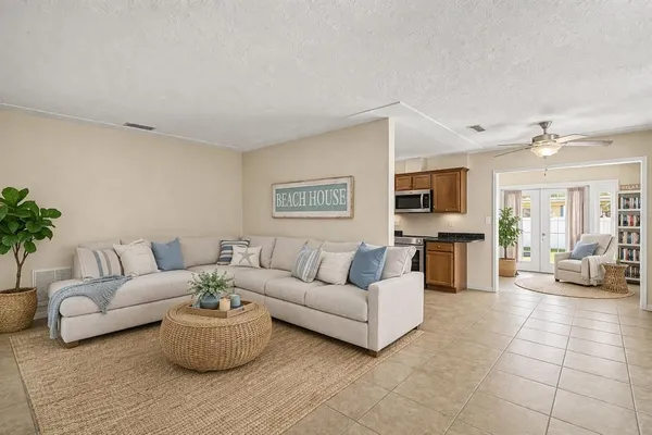 a kitchen with granite countertop stainless steel appliances and wooden cabinets