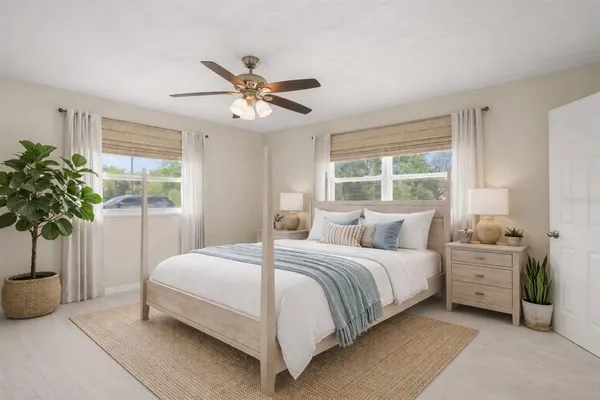 an empty room with closet and a chandelier fan