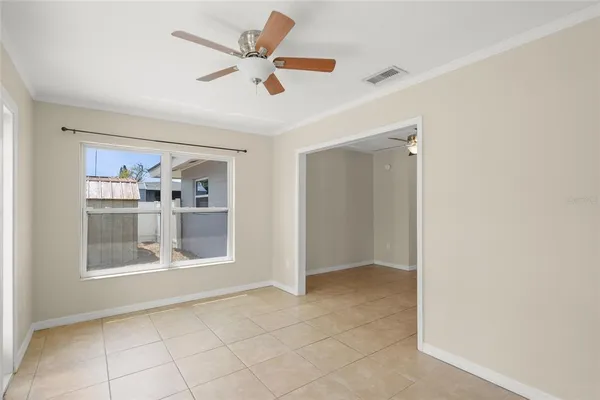 a view of an empty room with a window