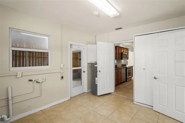 a view of a livingroom with wooden floor and a window
